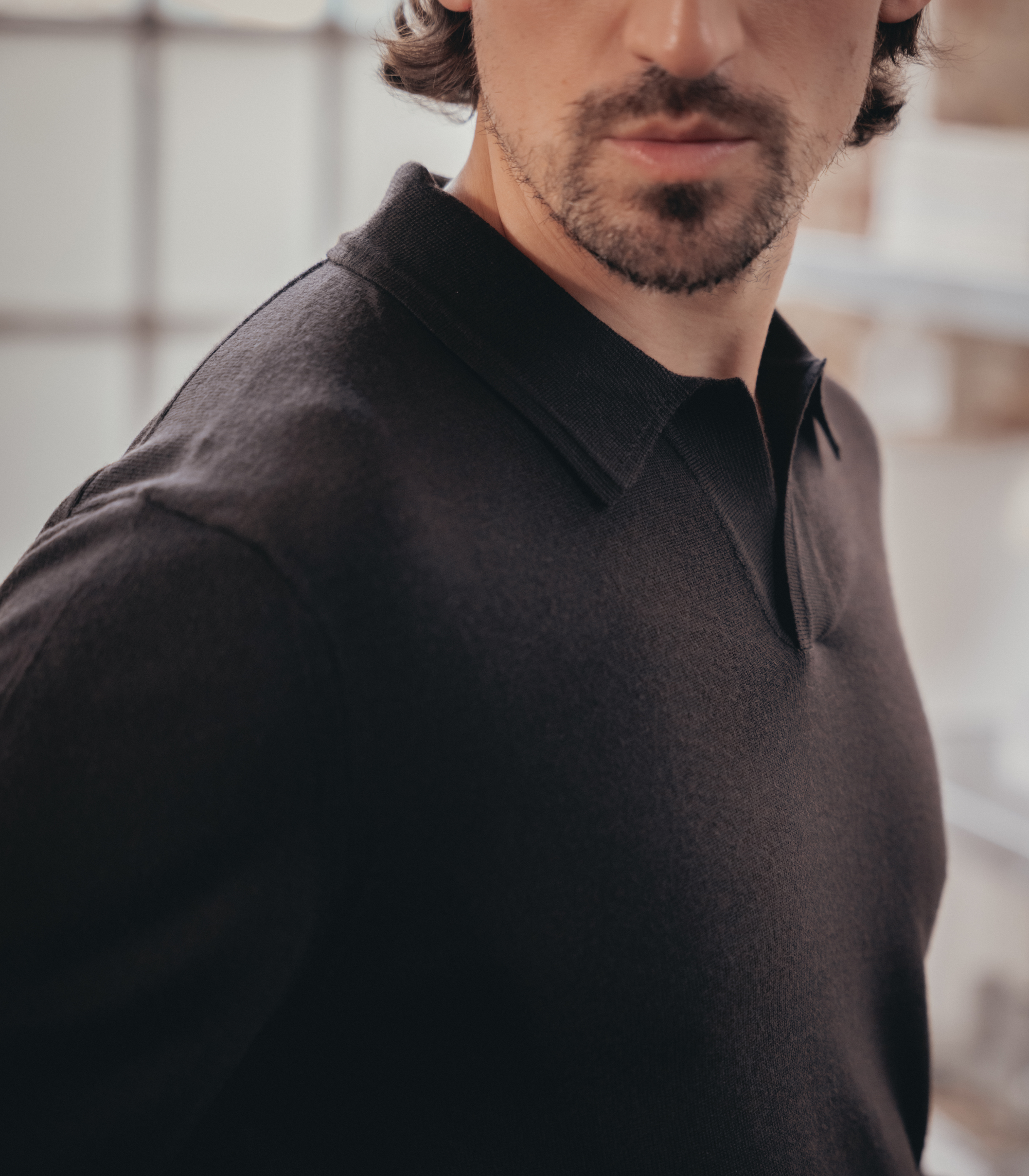 Close-up of Lestrange espresso long sleeve polo shirt with open collar, crafted from premium fabric