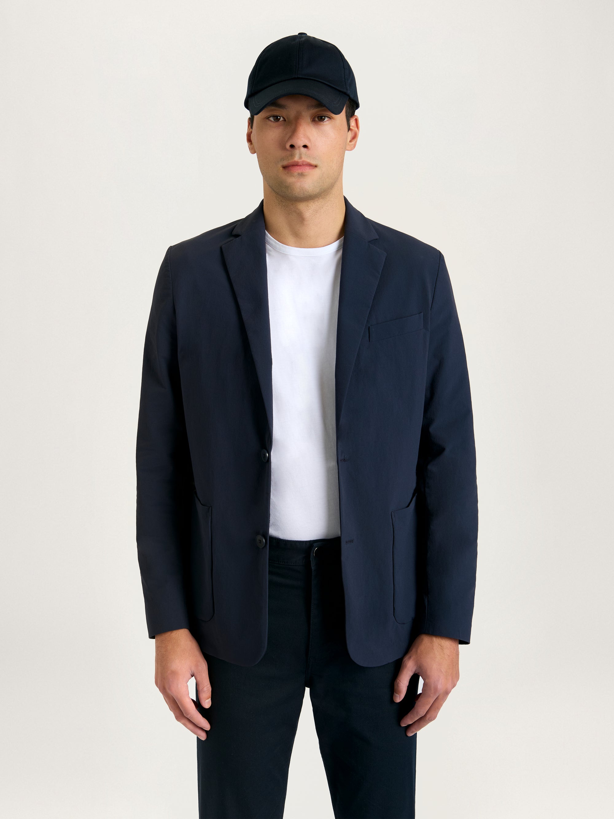 Lestrange Aerotech Blazer in navy, lightweight men’s blazer styled with a white t-shirt and dark trousers, perfect for versatile smart-casual wear.