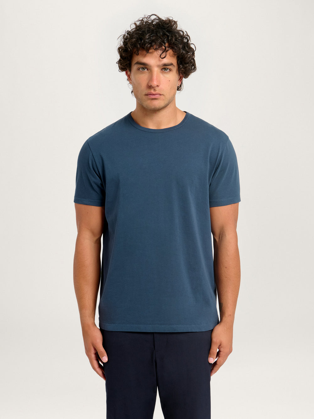 Model wearing Lestrange London Classic Tee in Pebble, short sleeve organic cotton t-shirt, front view