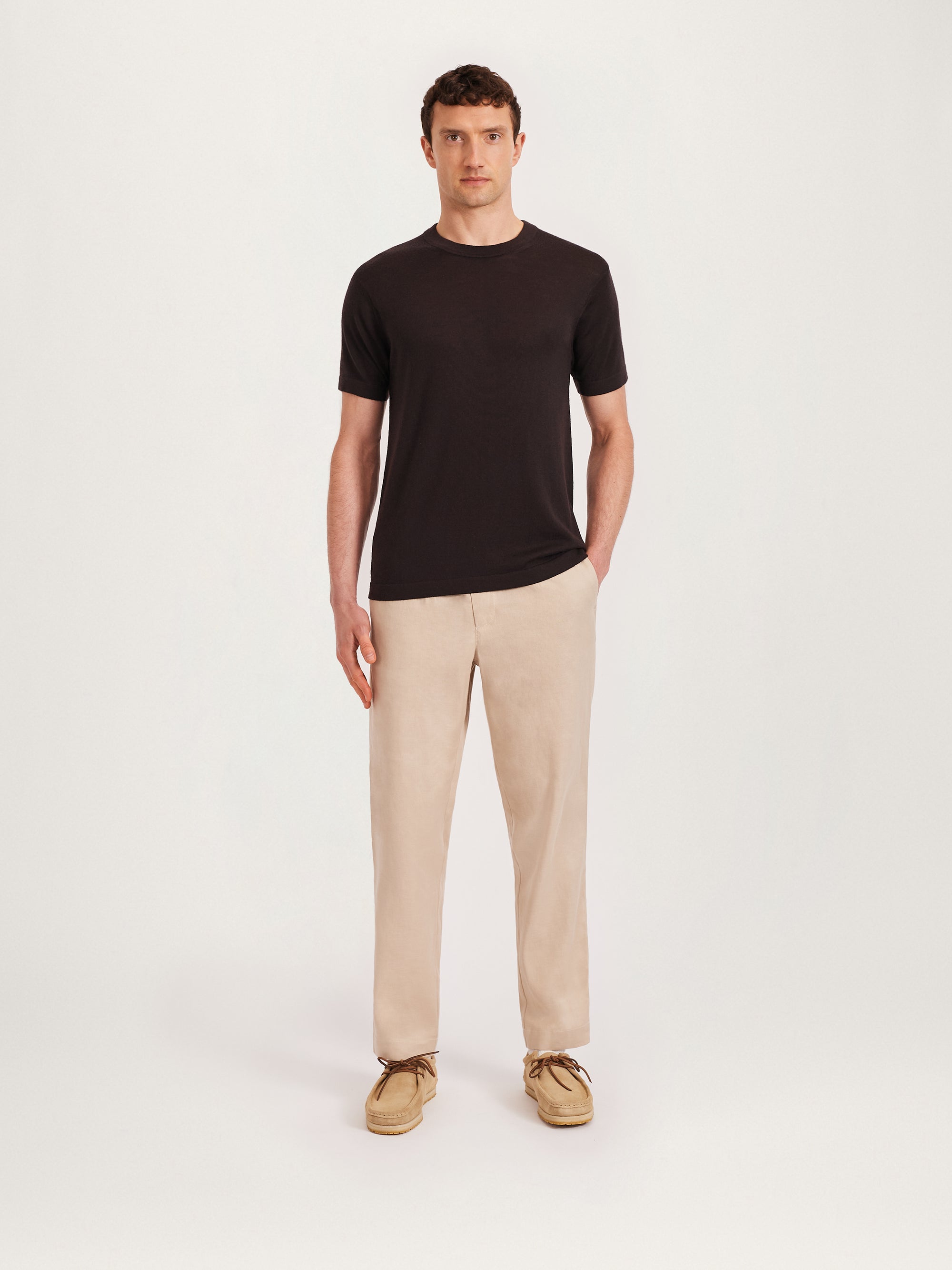 Men’s coffee brown knitted T-shirt styled with beige trousers and suede shoes – Lestrange London