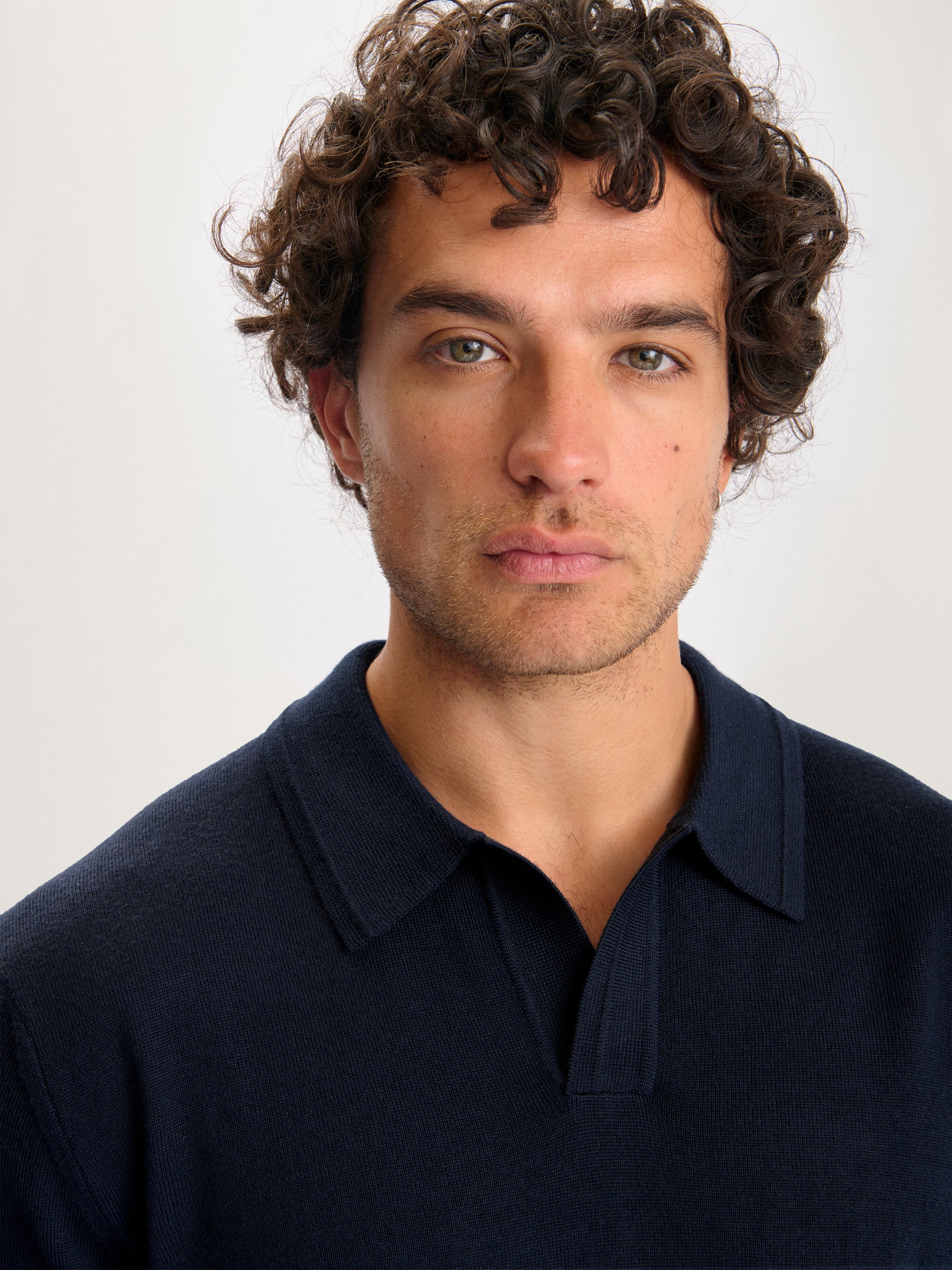 Lestrange Merino Long Sleeve Polo Navy – close-up of fine merino knit polo with open collar design
