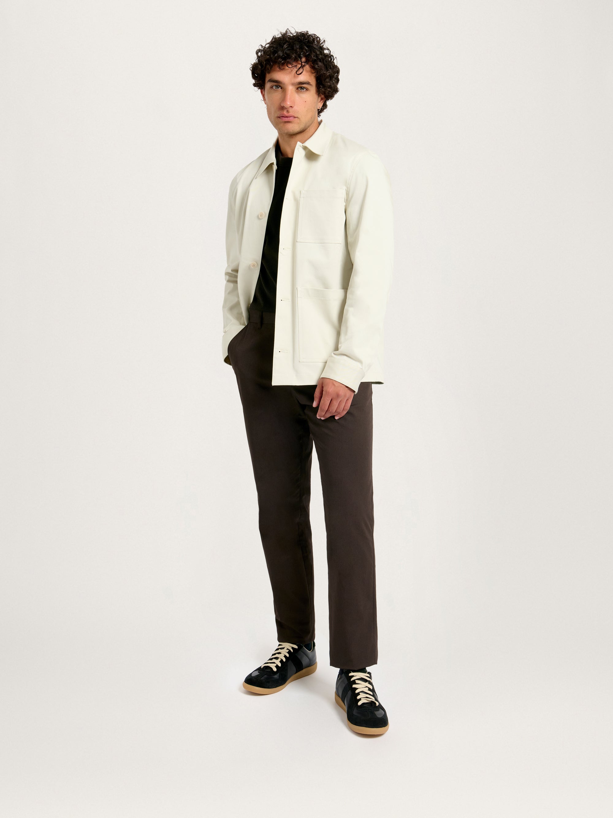 Men’s Utility Jacket in Flint – Side angle outfit with black T-shirt and sneakers