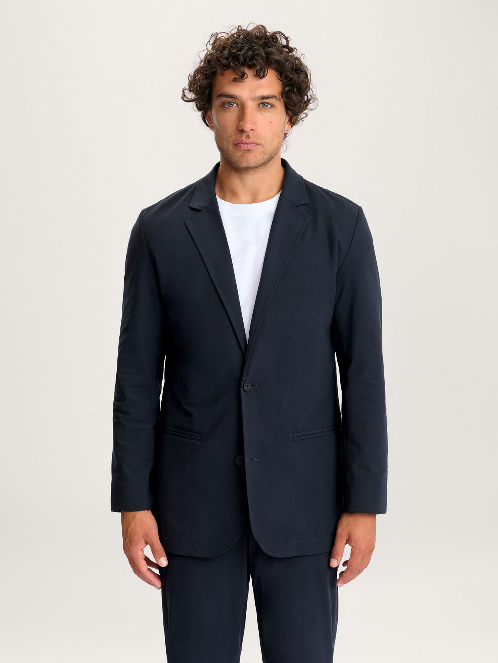 Men’s Lestrange 360 navy blazer – front view, tailored fit, styled with white T-shirt.