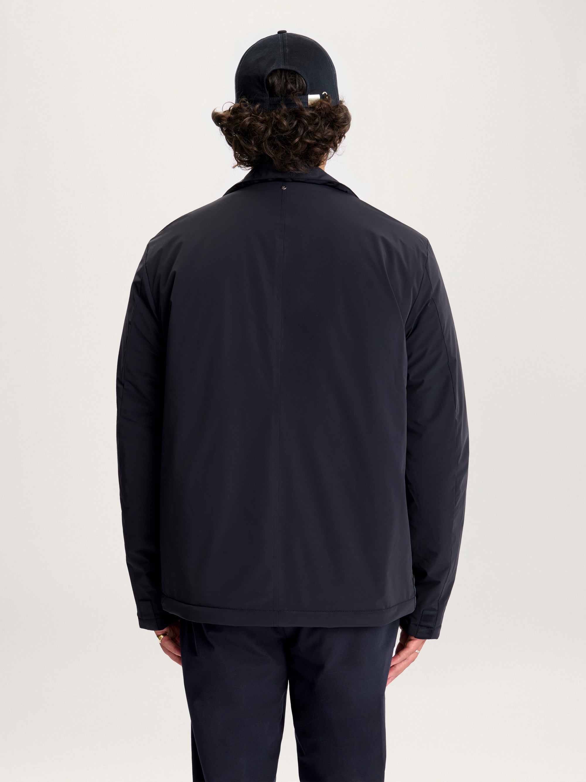 Back view of Lestrange 360 Thermal Jacket in navy, lightweight insulated men’s outerwear with clean minimalist design.