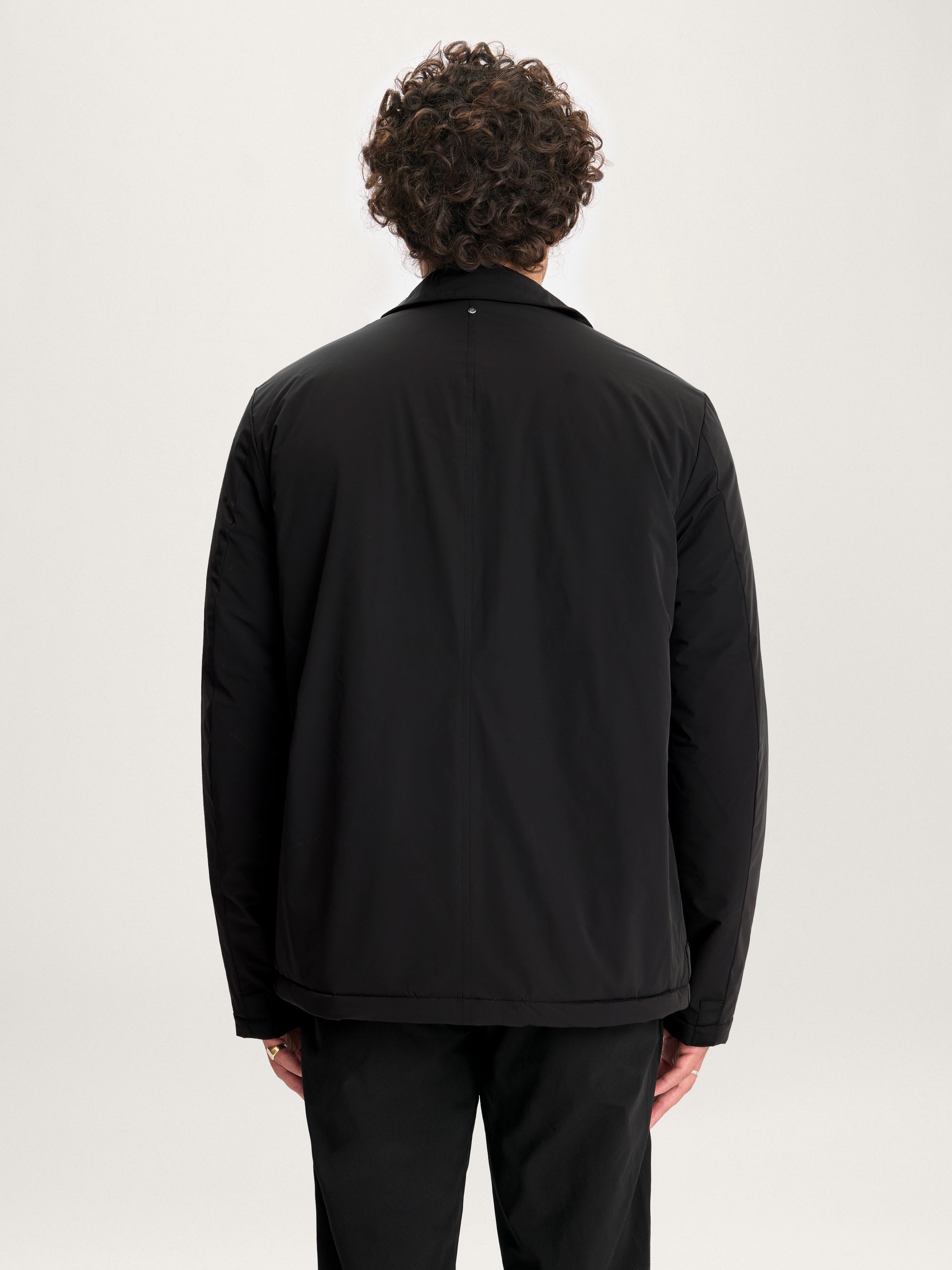 Back view of Lestrange 360 Thermal Jacket in black, lightweight insulated jacket with clean minimalist design.