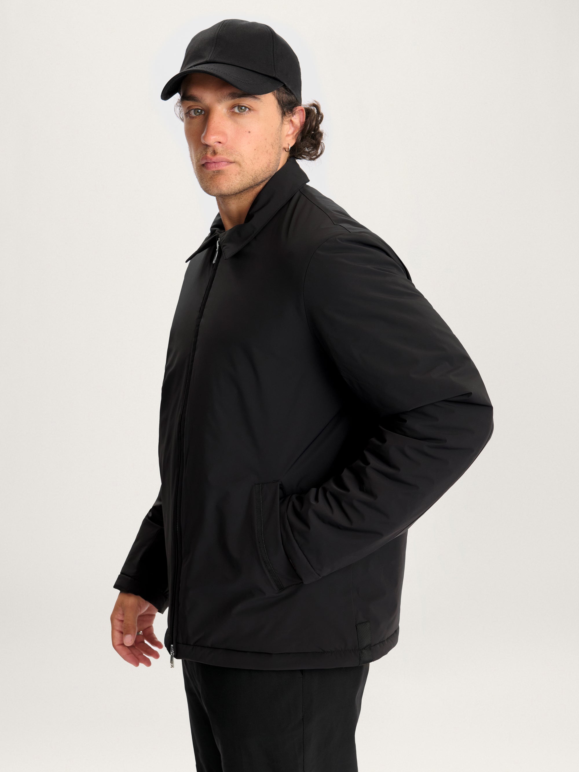 Side view of Lestrange 360 Thermal Jacket in black, insulated men’s jacket with zip front and side pockets