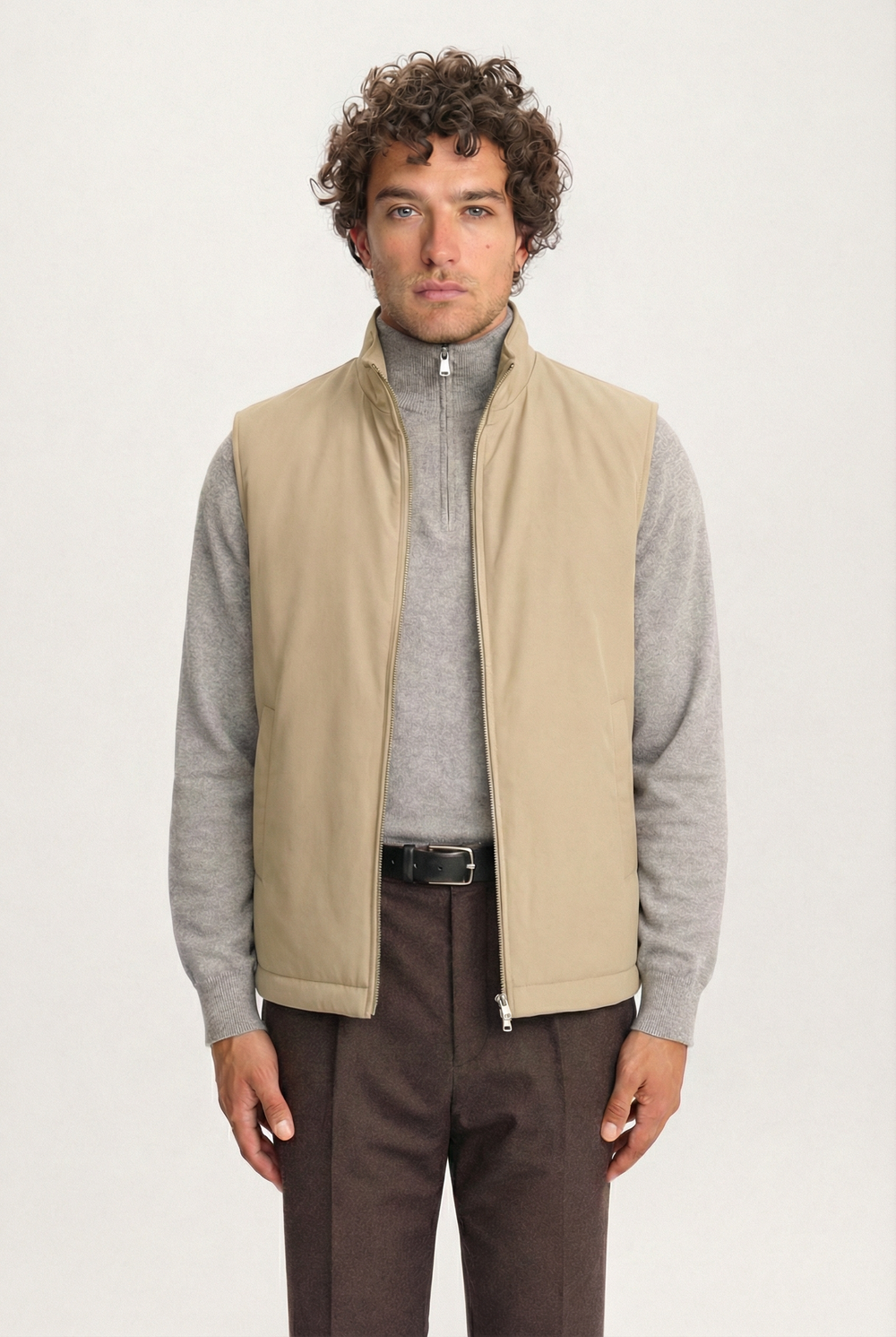 Men’s khaki Lestrange 360 Thermal Vest, front view, layered with grey knit and tailored brown trousers
