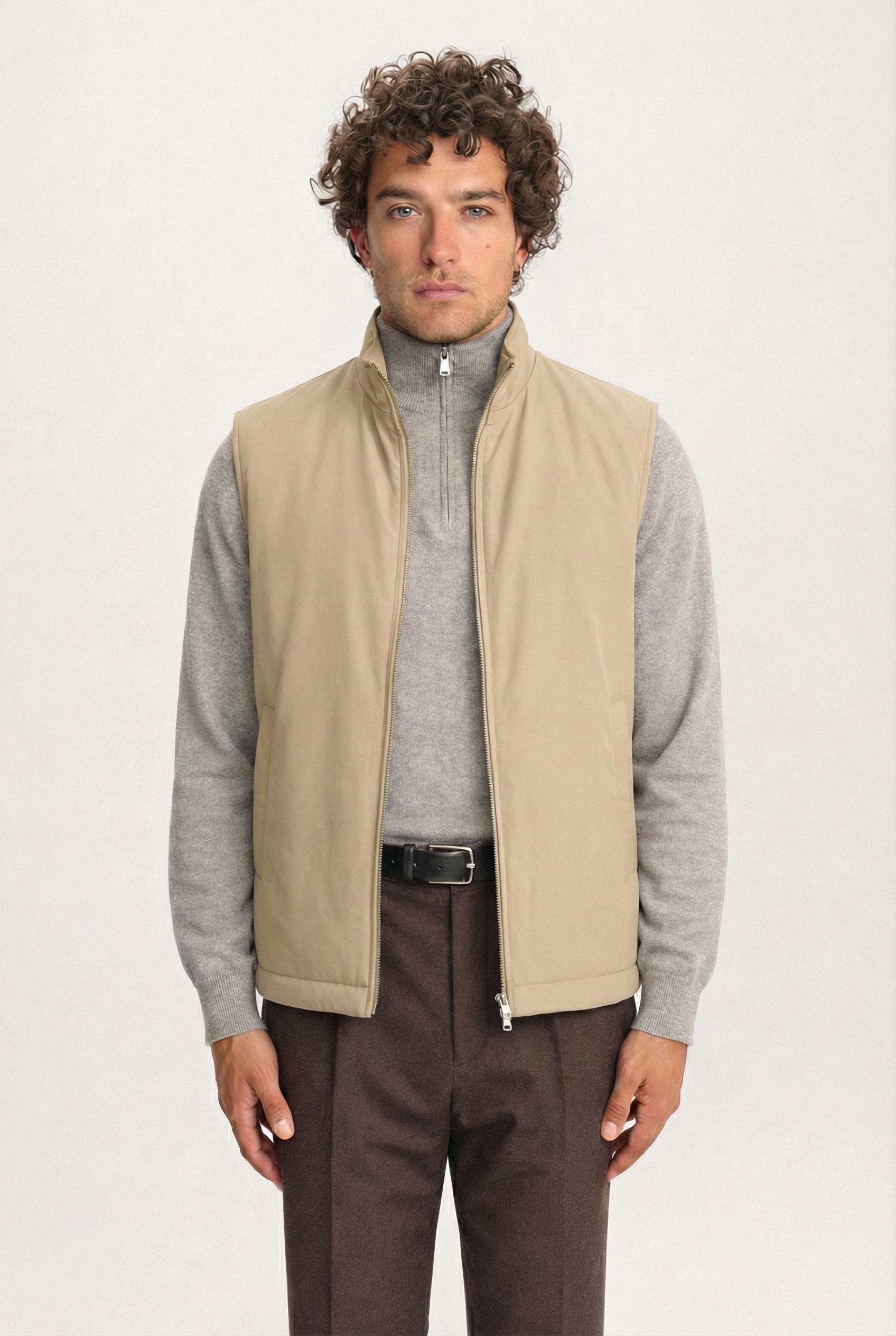 Men’s khaki Lestrange 360 Thermal Vest, front view, layered with grey knit and tailored brown trousers