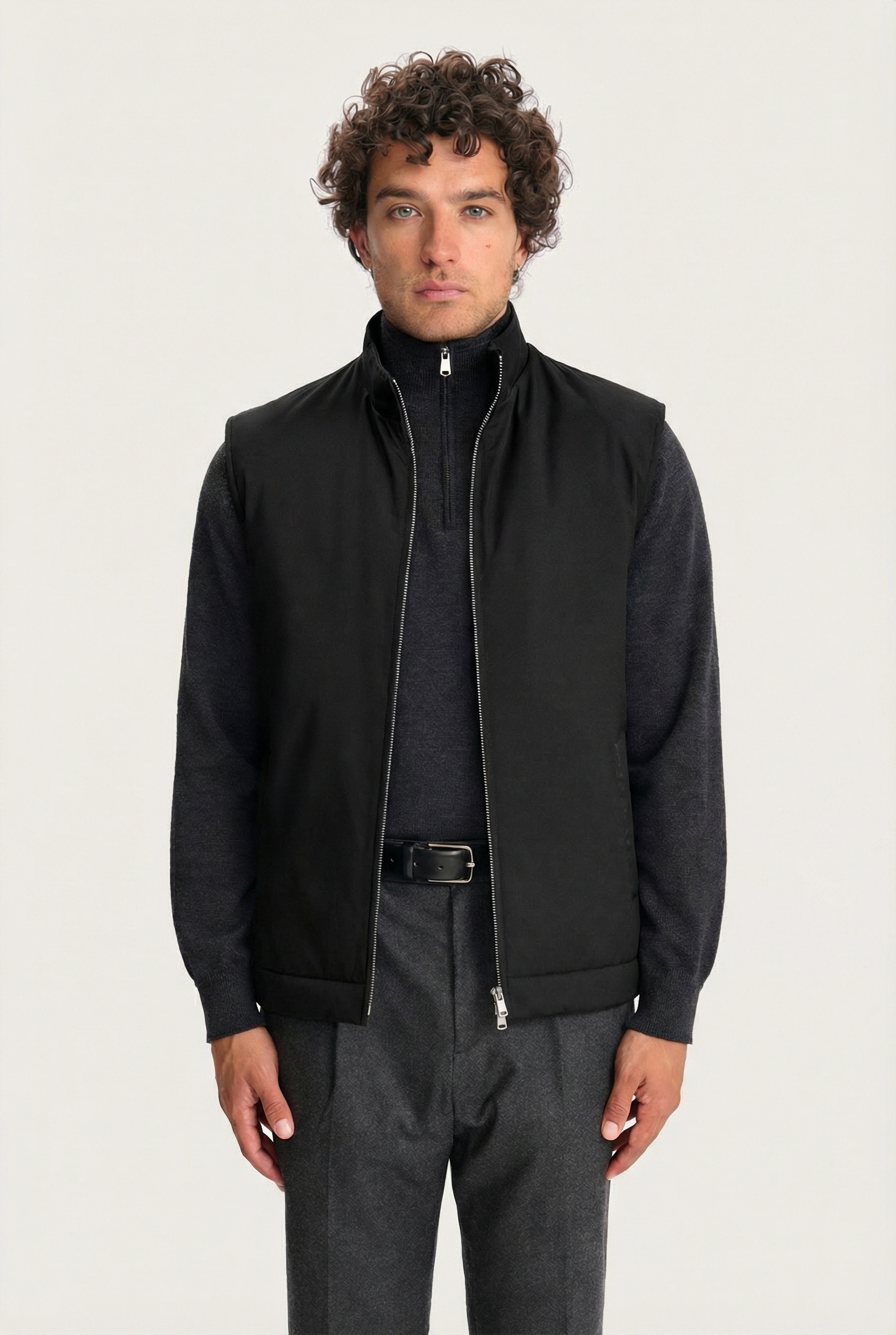Black Lestrange 360 Thermal Vest for men, front view, styled over dark grey zip-neck knit and tailored trousers