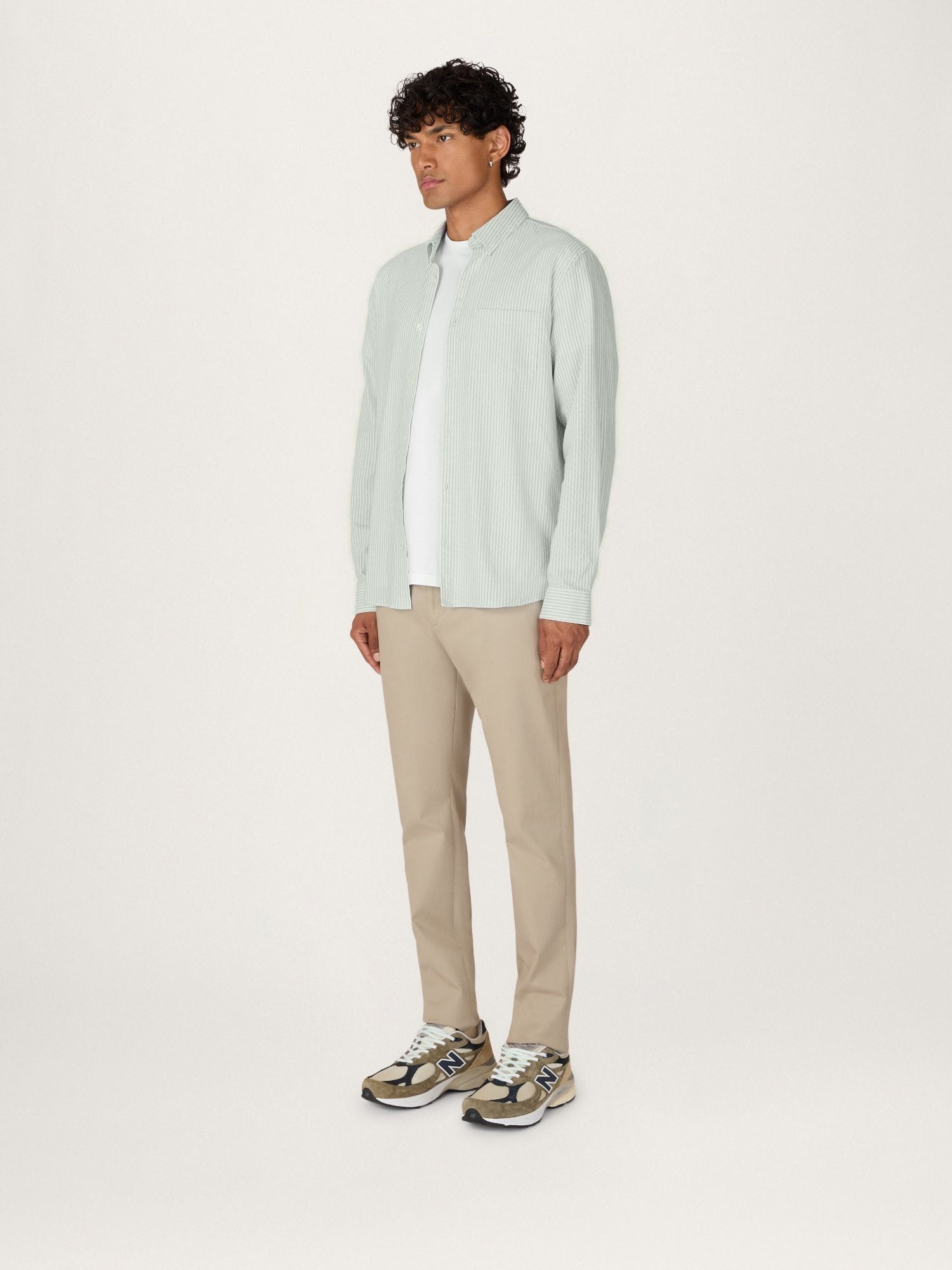 Lestrange Sage Stripe Cotton Oxford Shirt angled side view styled with neutral trousers