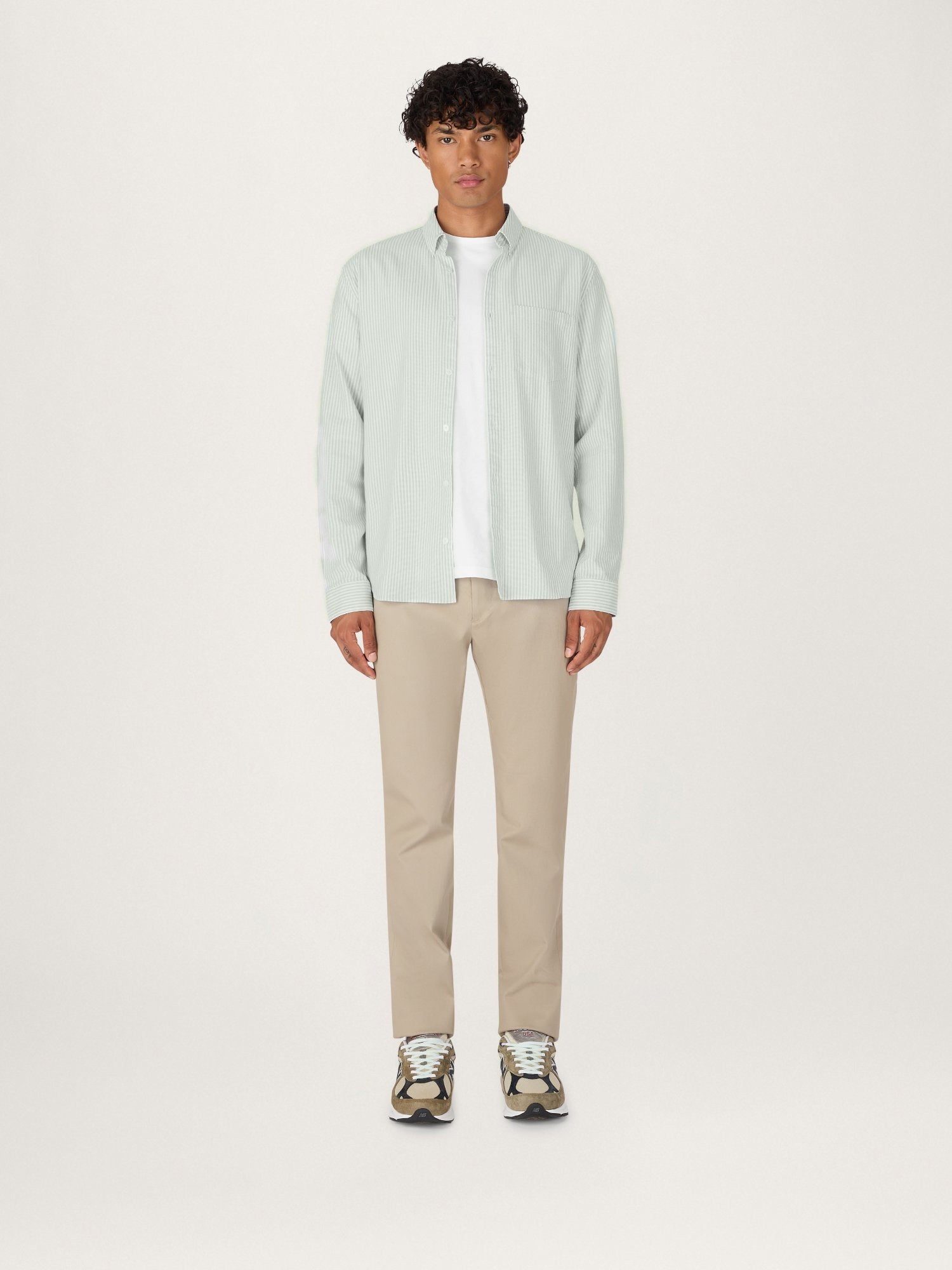 Lestrange Cotton Oxford Shirt in Sage Stripe worn front view with beige trousers and white t-shirt