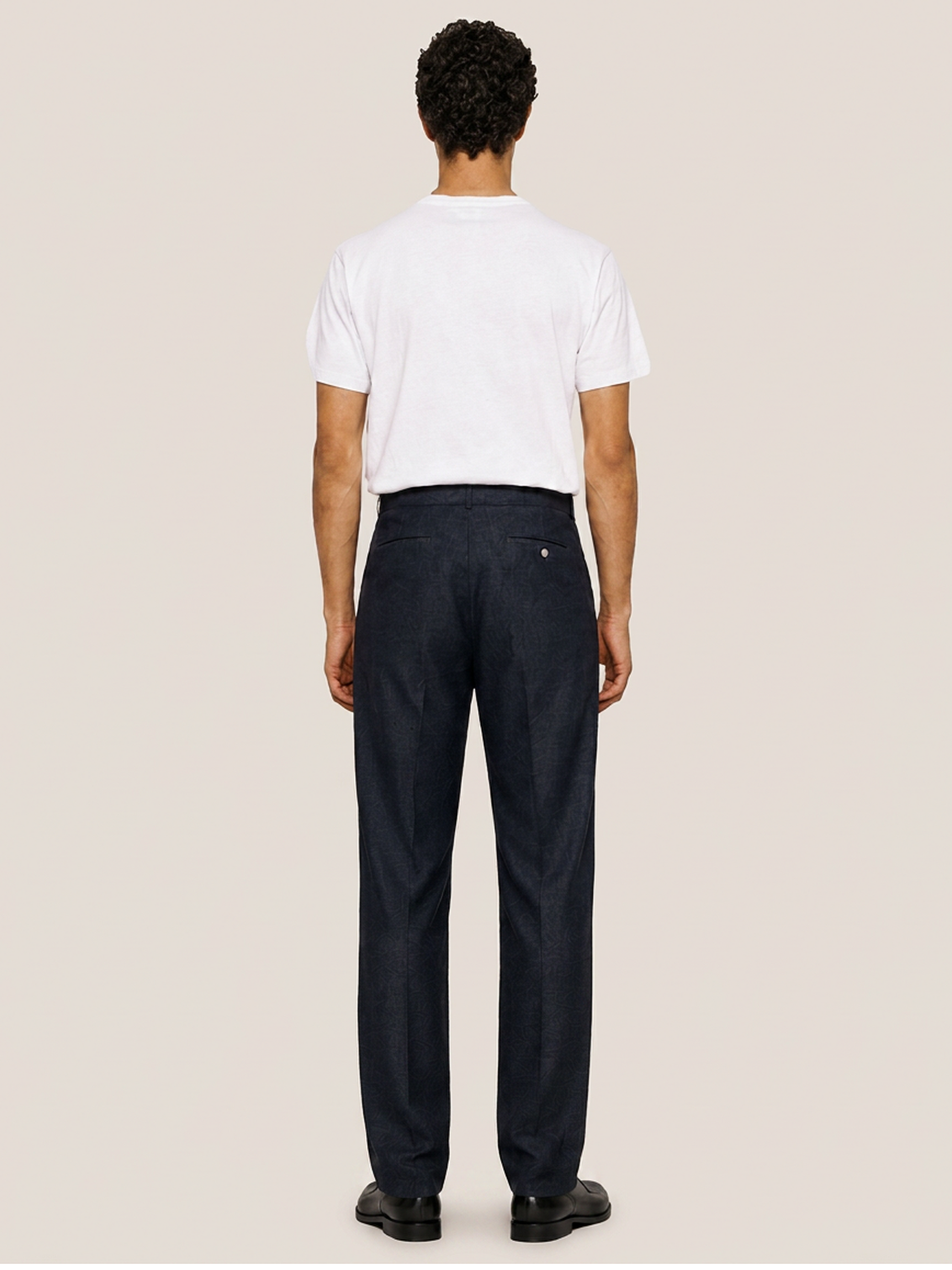 Back view of the LESTRANGE regular navy linen trousers, showing the tailored straight-leg fit, belt loops and back welt pockets.