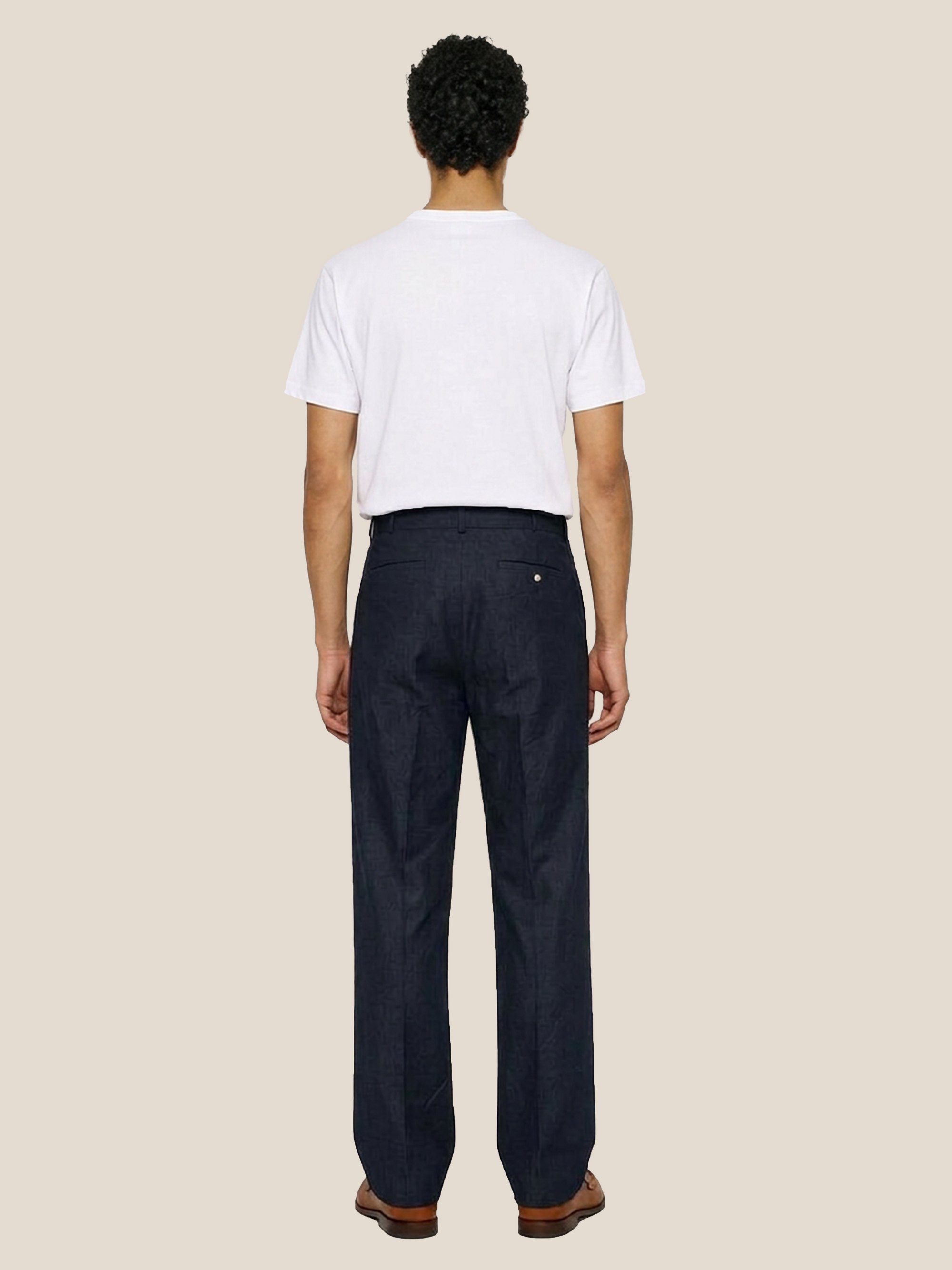 Back view of the LESTRANGE navy linen trousers, showing the straight-leg fit, belt loops and back welt pockets.