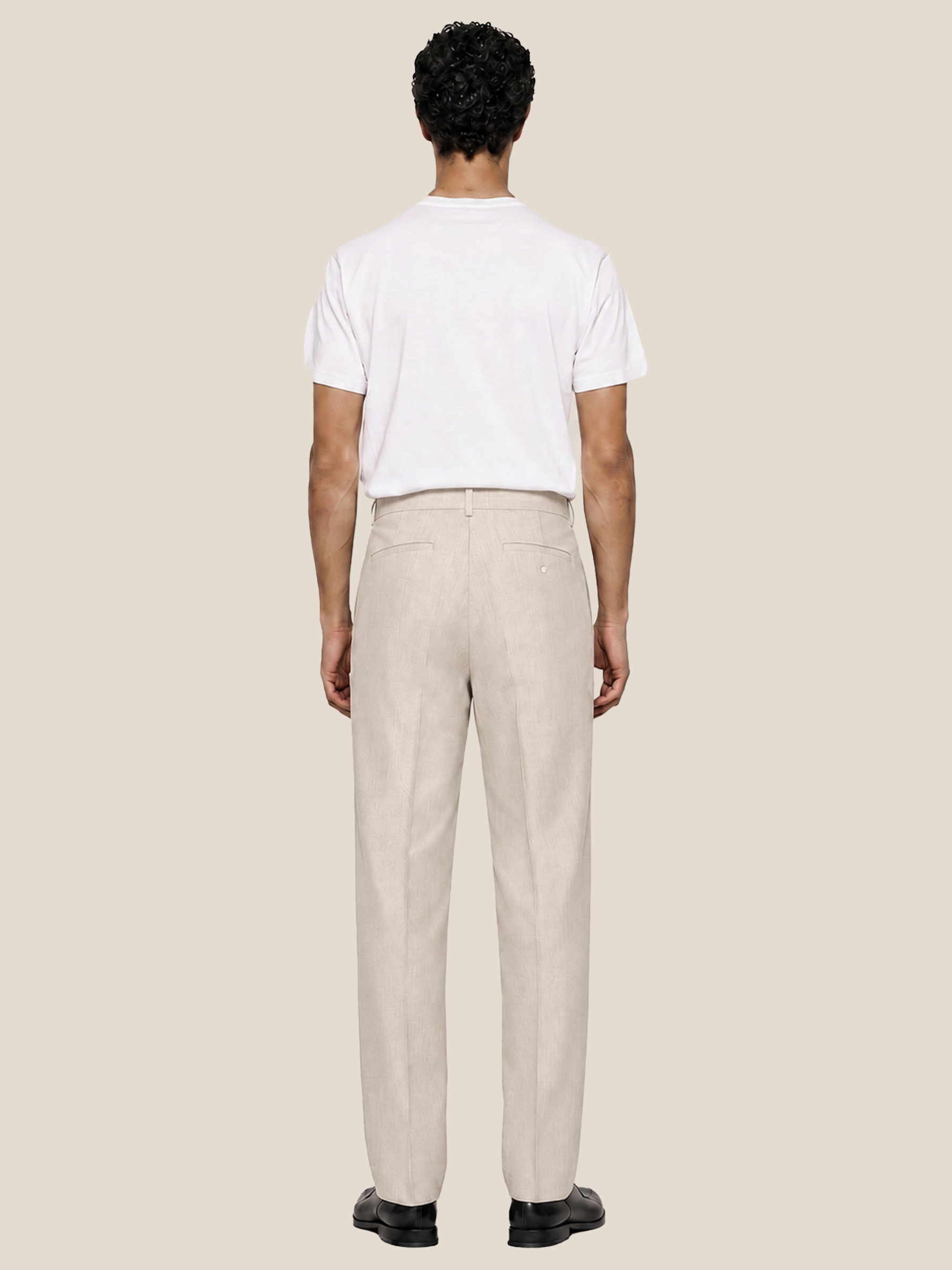 Back view of the LESTRANGE regular natural beige linen trousers, showing the tailored straight-leg fit, belt loops and back welt pockets.