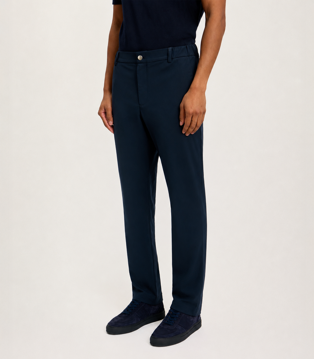 Close-up of the LESTRANGE 360 Trouser in navy, showing the waistband, button fastening and smooth stretch fabric.