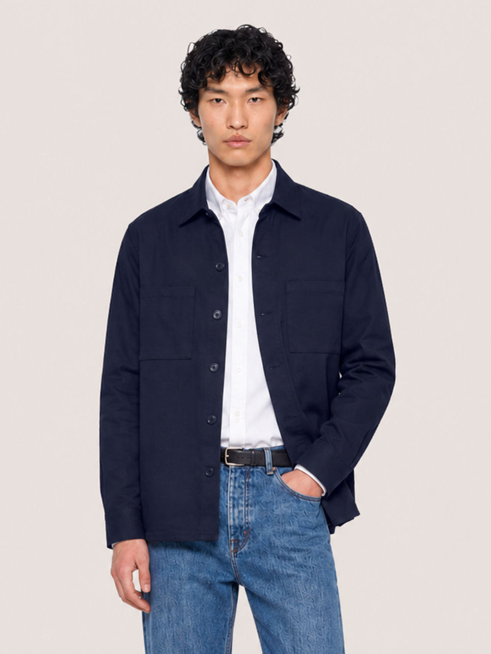 Half-body view of the LESTRANGE navy overshirt, showing the button front, chest pockets and relaxed everyday fit.