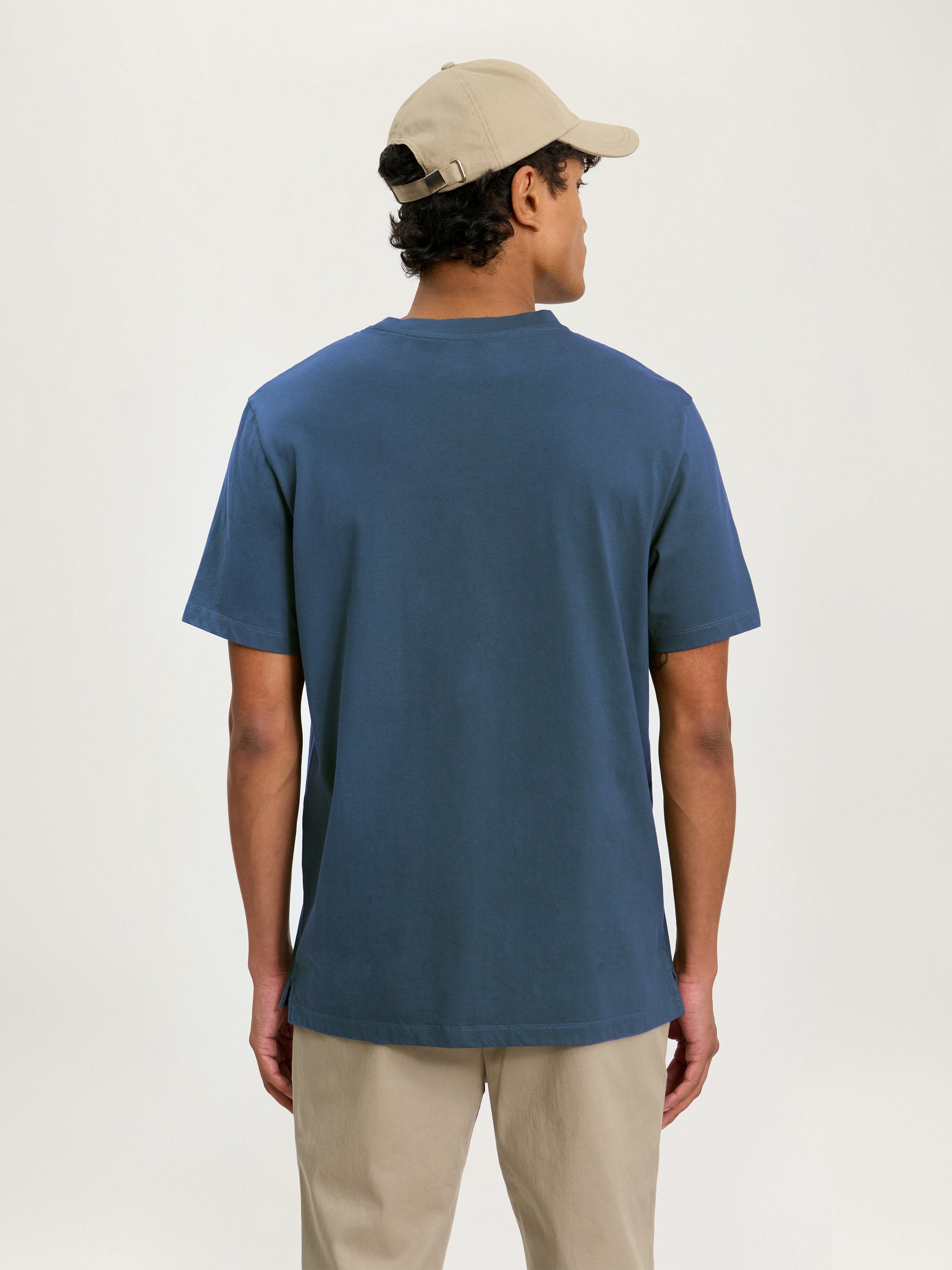 Back view of Lestrange heavyweight cotton T-shirt in petrol blue with clean, minimal finish