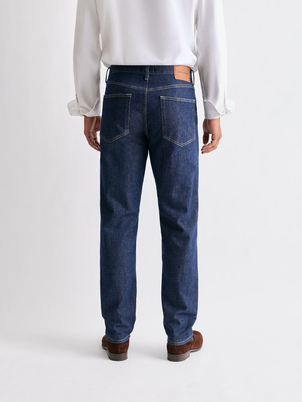 The 24 Jeans Straight Fit in Dark Blue, rear view showing back pockets and straight-leg fit