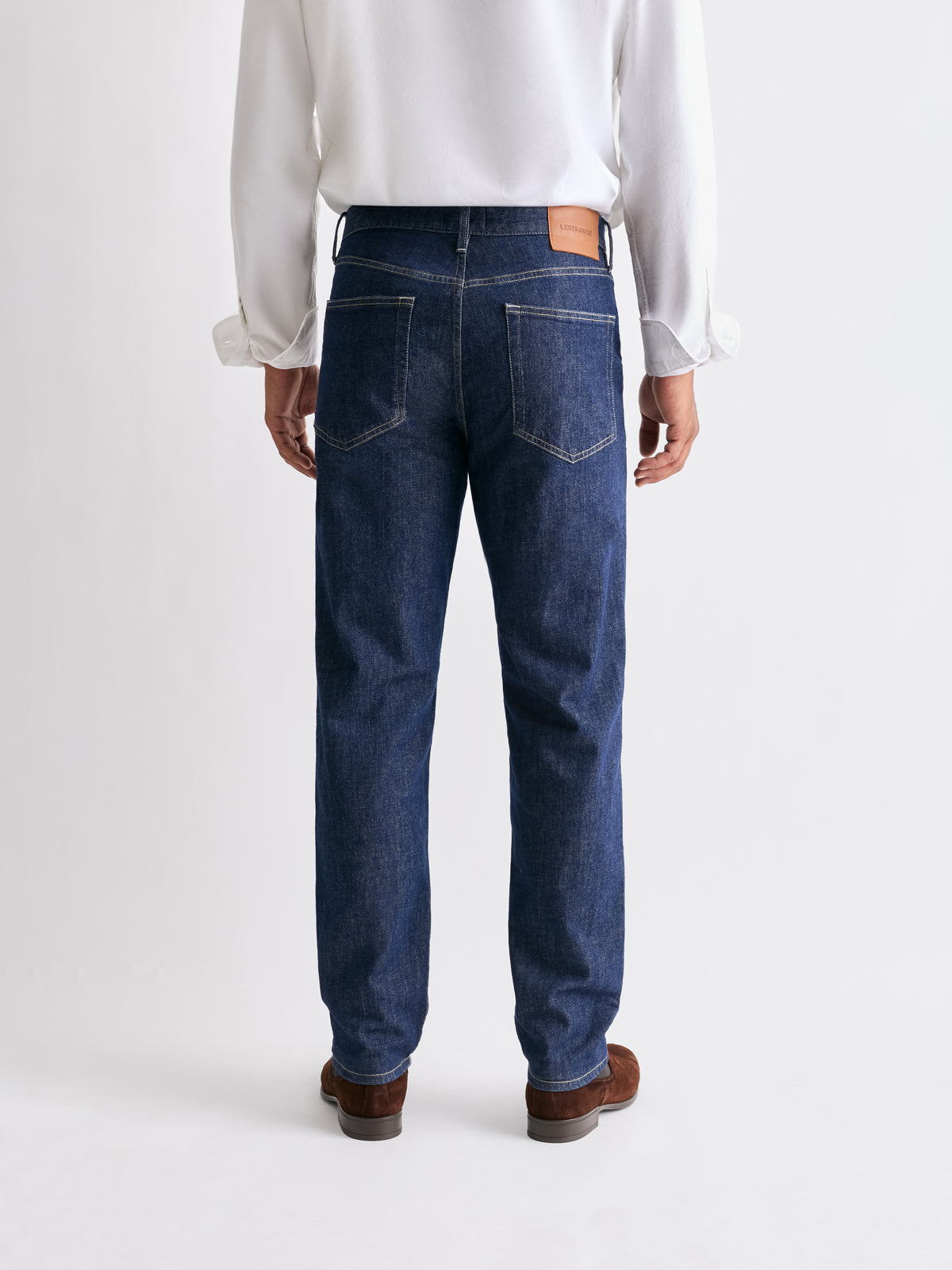The 24 Jeans Straight Fit in Dark Blue, rear view showing back pockets and straight-leg fit