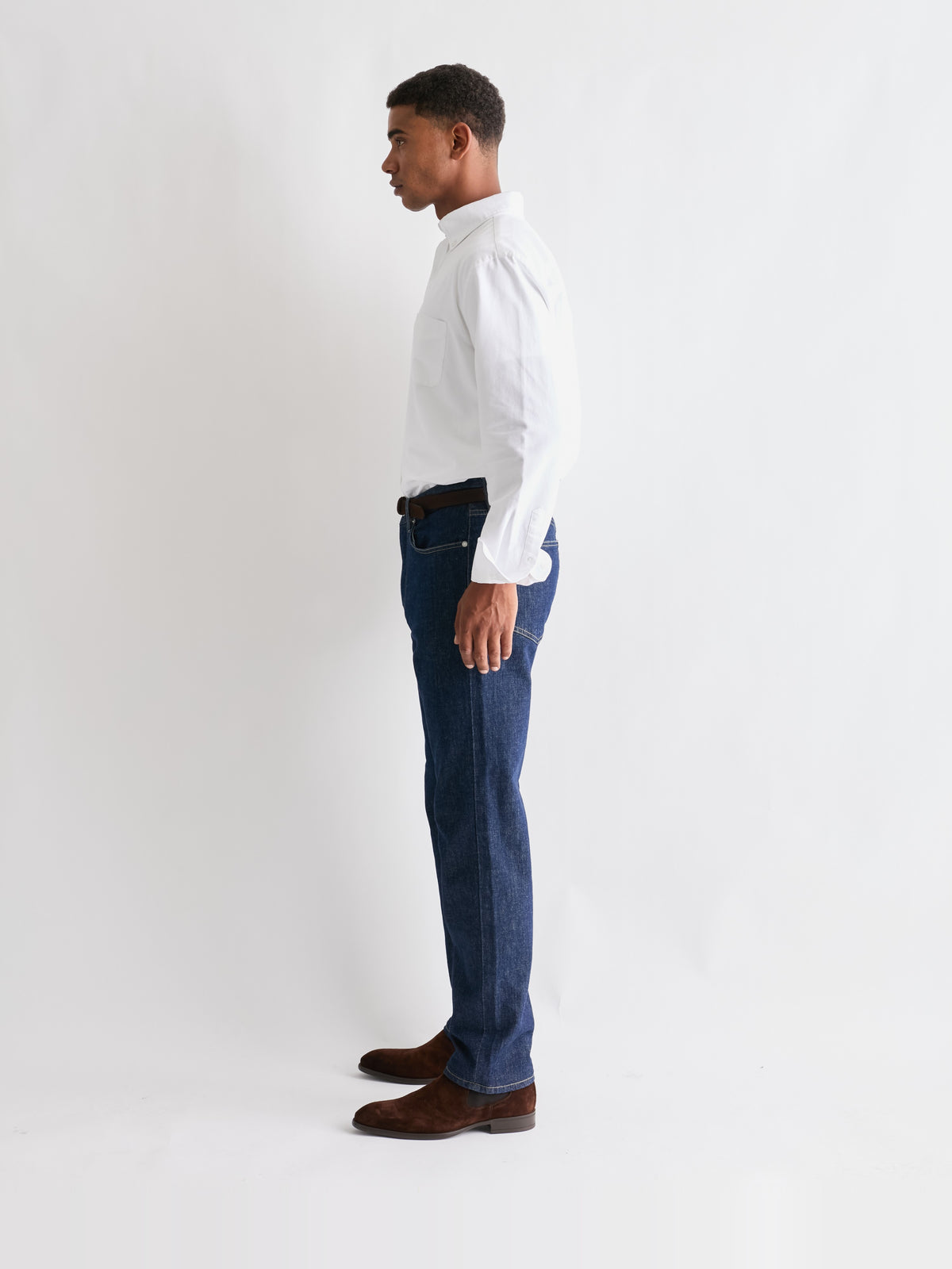 The 24 Jeans Straight Fit in Dark Blue, side profile styled with a white shirt
