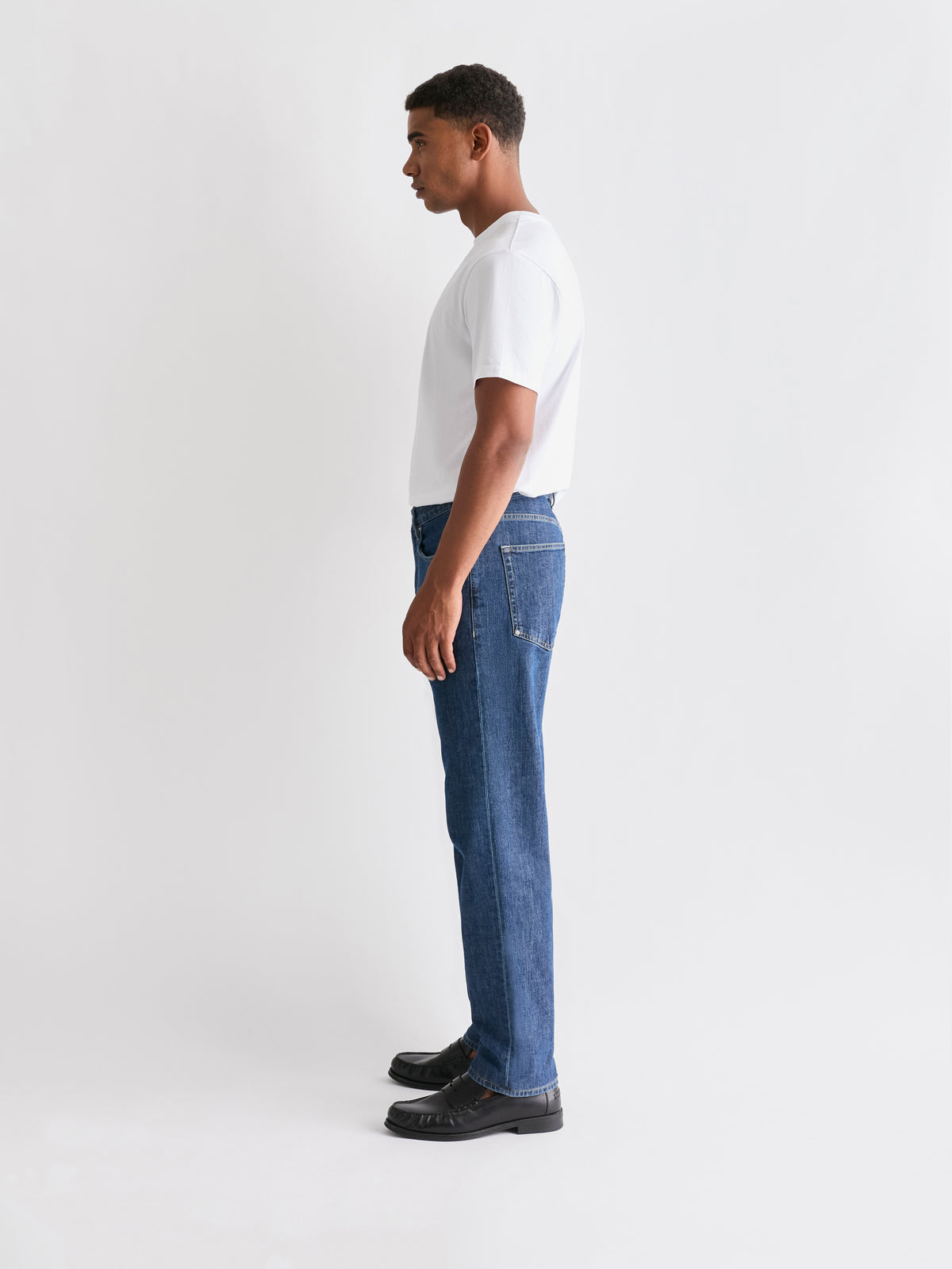The 24 Jeans Straight Fit in Mid Blue, side profile showing the straight-leg fit