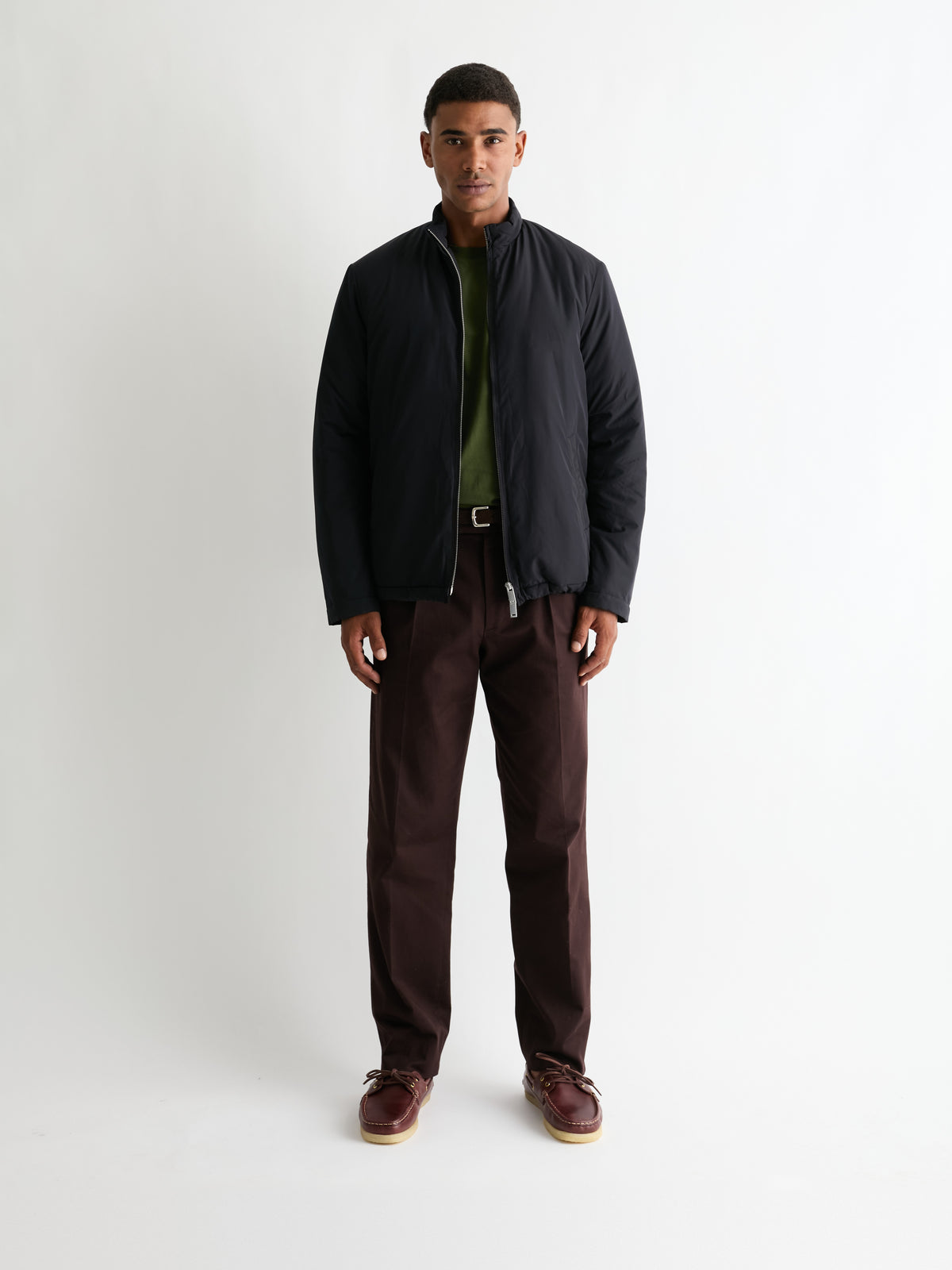 The Heavyweight Tee in Dark Olive, layered under a navy jacket